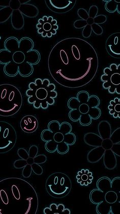 a black background with flowers and smiley faces drawn on it's sides, all in different colors