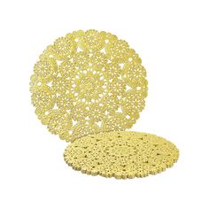 a yellow doily sitting on top of a white table next to another doily