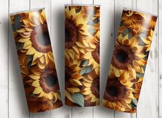 three sunflowers are shown on the side of two vases