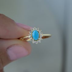 Looking for a stunning turquoise ring? Look no further! The turquoise is set against a cubic zirconia halo where it allows the turquoise to really pop! It's suitable for everyday wear! - - - D E T A I L S - - - * Made of 925 Sterling Silver * THICK plating of 14k Gold or Rhodium * Available in Sizes 4-10 * Made of highest quality lab created turquoise and cubic zirconia * VERY HIGH QUALITY * Nickel-free & Hypoallergenic - will NOT turn fingers green! * Turquoise Stone: 4x6mm Ring Sizer Tool https://samijewels.etsy.com/listing/1240904225 🎁 Comes in a gift-box, ready for gift giving!  ✈️ Ships same day for fast delivery!  ♡ Made with 100% Pure Love!  🥰 Happy to answer any questions you may have!  🤗 Let's Connect!  IG: samijewels_ Luxury Vintage Turquoise Ring Gift, Turquoise Gemstone Ring, Turquoise Ring Gold, Turquoise Diamond Ring, Gold Ring Stacking, Turquoise Stone Jewelry, Vintage Turquoise Ring, Turquoise Statement Ring, Ring Turquoise