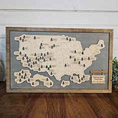 a wooden map with trees on it