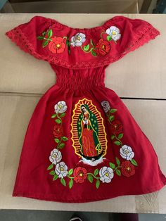 Girls Authentic Mexican Virgin Mary Embroidered Dress | GuadalupeGirl's Virgin Mary Dress.Mexican our lady of Guadalupe  BEAUTIFUL embroyder  peasant dress for girls,you  short sleeve dress ,lace stitching, s easy, your girls can stay comfortable and cool  AVELEBEL SIZE 2T/3T/4/5/6 Virgin Mary Quinceanera Dress, Mexican Tops, Traditional Mexican Clothing, Mexican Top, Mexican Quinceanera Dresses, Quinceanera Themes Dresses, Traditional Mexican Dress, Mexican Babies, Mary Dress