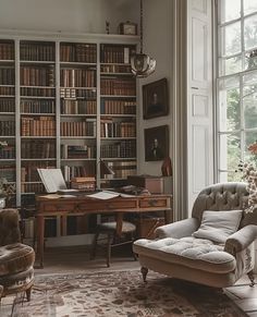 a living room filled with lots of furniture and bookshelves next to a window