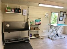 a room with a table, shelves and other items