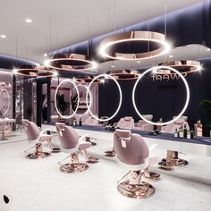 the interior of a hair salon with chairs and mirrors on the wall, lights hanging from the ceiling