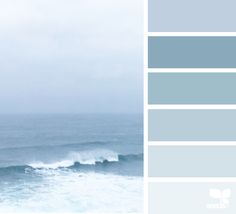 the ocean is blue and gray with white waves