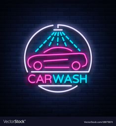 car wash neon sign in the shape of a circle on a dark brick wall background