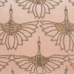 an embroidered fabric with beading on it