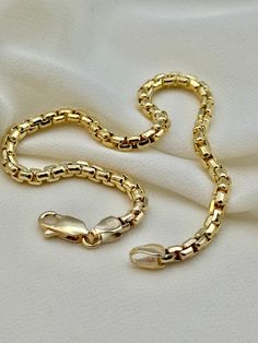 14k Gold Box bracelet , 5.85 gr ,8.5 " ,3.5 mm 14k Gold Box bracelet , 5.5 gr ,8" ,3.5 mm 14k Gold Box bracelet , 5.110 gr ,7.5" ,3.5 mm Premium lobster clasp for added safety! Priced to sell! Compare our prices to other similar sellers! Arrives in a GIFT BOX and includes FREE SHIPPING within the USA and Canada. International shipping is available at the most economical rates on ETSY. I HAVE BEEN IN THE JEWELRY BUSINESS ALL MY LIFE. I am a second -generation family member making gold and jewelry 14k Gold Box Chain Bracelet, 14k Gold Round Box Chain Bracelet, 14k Gold Box Chain Bracelets For Anniversary, 14k Gold Box Chain Bracelet For Anniversary, Anniversary Yellow Gold Box Chain Bracelet, Men's Necklace Gold, Gold Necklace For Men, Bracelet For Him, Real Gold Chains