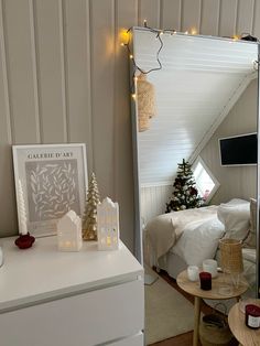 a bedroom with a christmas tree in the corner