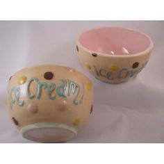 two ceramic bowls with the words ice cream painted on one bowl and the other bowl