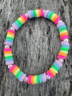 a bracelet with multicolored beads on it