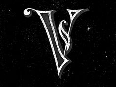 the letter v is drawn in white on black paper