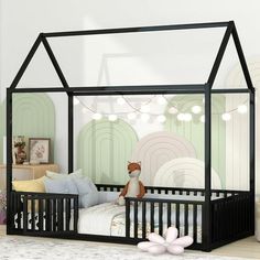 a child's room with a bed, crib and stuffed animals