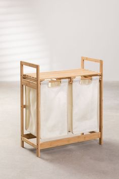 a wooden shelf with two white bags on it