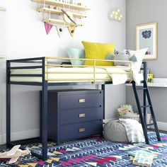 a child's bedroom with a bunk bed, desk and toy chest in the corner