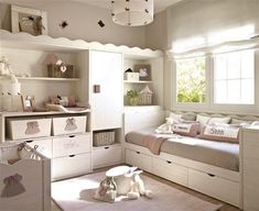 a child's bedroom with white furniture and pink accessories on the bed, dressers and shelves