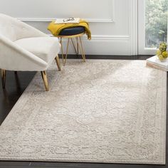 a white rug with an ornate design on it