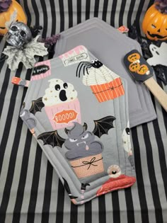 halloween themed placemats on striped table cloth