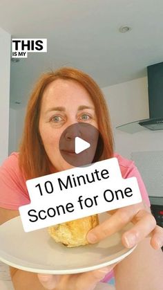 a woman holding a white plate with a sign on it that says 10 minute scone for one