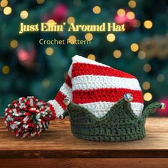 a crocheted christmas hat with a pom - pom