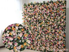 the wall is covered with many different flowers