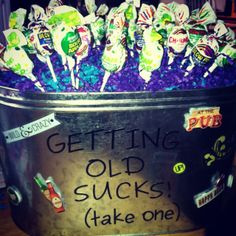 a bucket filled with lots of candy sitting on top of a table