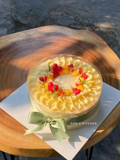 a cake sitting on top of a wooden table