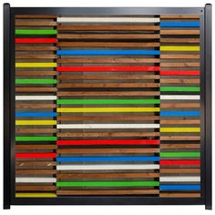 an art piece made out of wood and colored strips