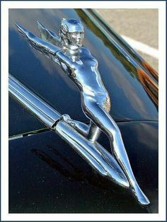 the hood ornament of an old car is shown in this image with blue border