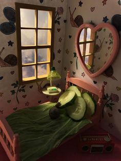 there is a bed with cucumbers on it and a mirror above the bed