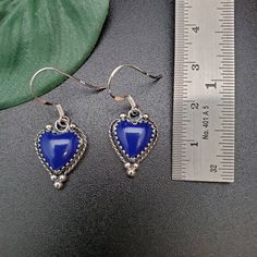 Visit our on-line shop at: Etsy.com/shop/AlbuquerqueDesigns *sterling silver earrings *dangles / drops / ear wires / hooks *southwestern jewelry *blue lapis lazuli *calibrated pre-cut stones: 10x10mm heart shape *back of jewelry items are all covered / do not show the back of stones *all jewelry items are made to ship, slight variations in stones will occur comparing to pictures. *size of a penny is 19mm or a dime is 18mm in diameter for comparing size with jewelry items. *handcrafted in USA *fr Sterling Silver Heart Beads Dangle Earrings, Elegant Blue Jewelry With Heart Beads, Sterling Silver Heart-shaped Earrings With Heart Beads, Sterling Silver Heart Earrings With Heart Beads, Valentine's Day Blue Heart Earrings, Blue Heart Earrings For Gift, Blue Heart Charm Earrings For Valentine's Day, Blue Elegant Heart Earrings For Pierced Ears, Blue Heart Cut Earrings For Valentine's Day