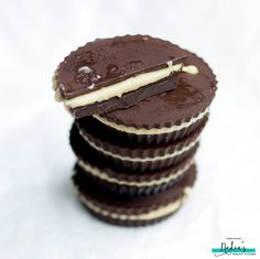 a stack of chocolate cupcakes sitting on top of each other