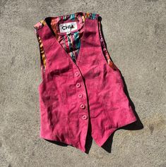 Vintage real leather vest Buttery soft hot pink suede fits estimated xs/s Estimated age 1980s Can be worn layered or as a sleeveless top Excellent vintage condition; normal light wear and distressing. Clean and odor free Approximate measurements 11" shoulder to shoulder 16.5" pit to pit 21.5" length All items are sold as is with no returns and no partial refunds. I describe and measure items carefully but may miss a slight flaw and all measurements should be considered approximate. Please zoom i Fitted Tank Top For Fall Festivals, Pink Fitted 90s Style Tank Top, Casual Fitted Vest For Festivals, 90s Style Spring Vest, Pink Fitted Sleeveless Vest, Fitted Pink Tank Top For Fall, 90s Style Sleeveless Vest For Spring, Fitted Pink Vest For Fall, Vintage Pink Tank Top For Spring