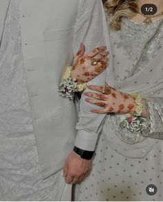 a man and woman with their hands covered in hendix are posing for the camera