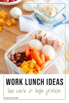 a plastic container filled with food sitting on top of a wooden table next to eggs, carrots and cheese