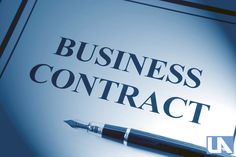 a business contract is shown with a pen