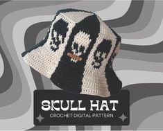 a crocheted hat with skulls on it and the words, scull hat