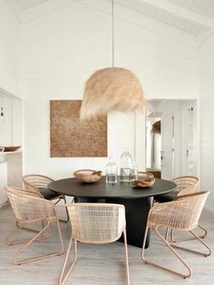 a black table with four chairs around it