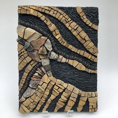 a piece of art made out of wood and stone