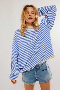 So cool and classic, this timeless crewneck is featured in an oversized, slouchy silhouette and staple striped print with contrasting hems for added dimension. **Fit:** Relaxed, oversized fit **Features:** Crew neckline, dropped shoulders, contrast hems **Why We | Classic Striped Oversized Crewneck by We The Free at Free People in Blue, Size: L Style Bleu, Beachy Outfits, Oversized Striped Sweater, Multicolor Sweater, Oversize Pullover, Fall Tops, Pull Oversize, Oversized Crewneck, School Clothes