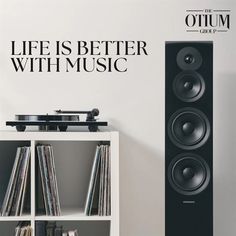 there is a wall decal that says life is better with music