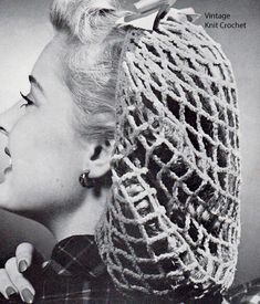 an old photo of a woman with a knitted hat on top of her head