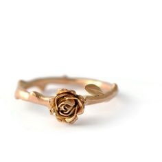 a gold rose ring on a white background