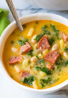 a close up of a bowl of soup on a table