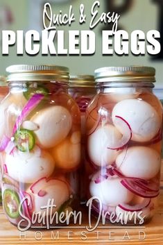 two jars filled with pickled eggs on top of a wooden table