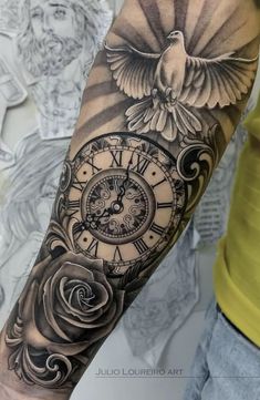 an arm with a clock and bird on it