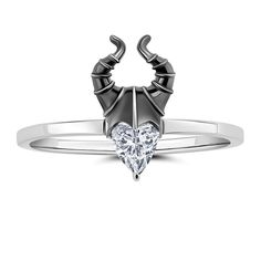 a heart shaped diamond ring with horns on the front and back, set in white gold