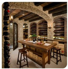 a wine cellar with wooden tables and stools