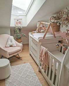 a baby's room with a crib, rocking chair and bed in it